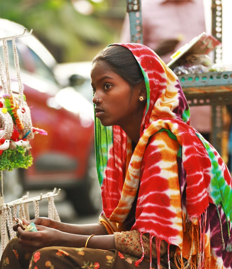 A young woman at her market stall of woven crafts in Bengaluru