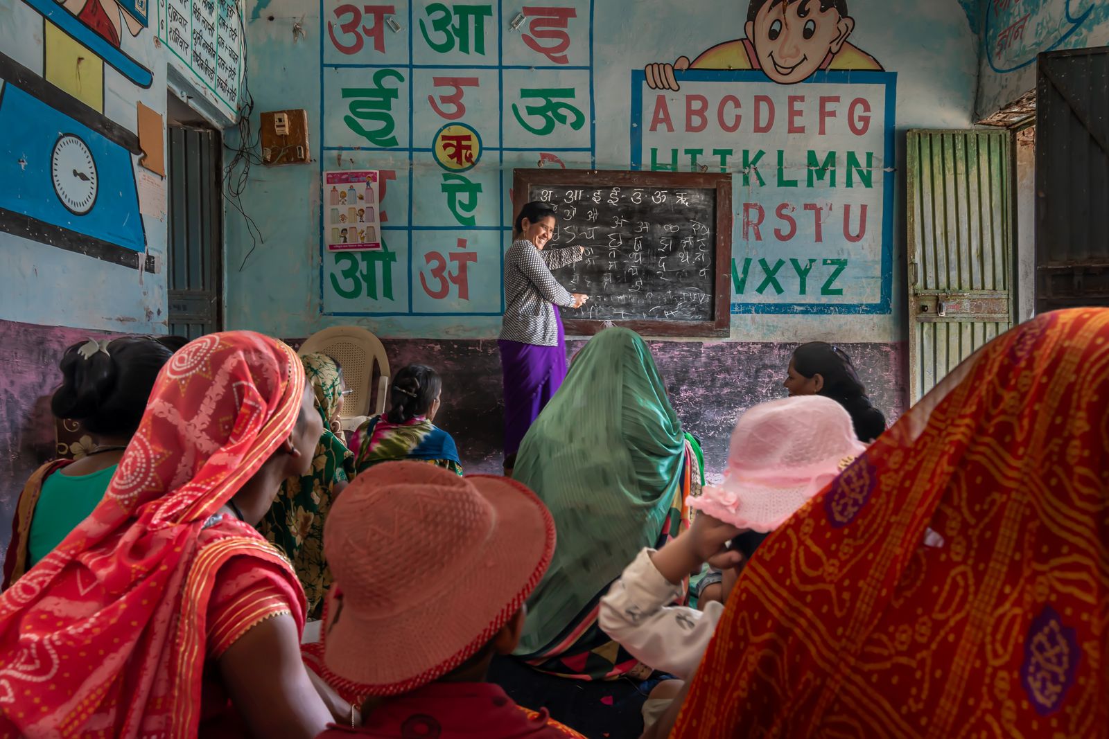 Women taking part in an education session in a rural classroom in India